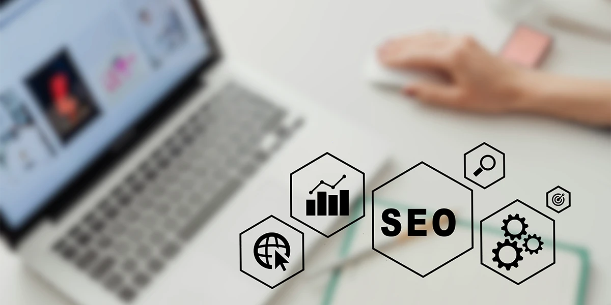 An SEO icon overlay on a laptop screen featuring data charts and global connectivity icons, illustrating a Dubai SEO agency’s multichannel approach including technical SEO, Arabic/English bilingual optimization, and E-E-A-T signals.